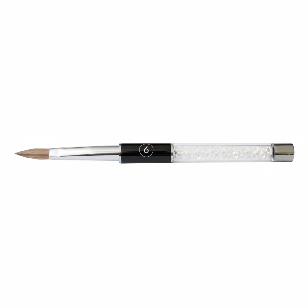 Acrylic nail brush with a black handle and silver ferrule on a white background