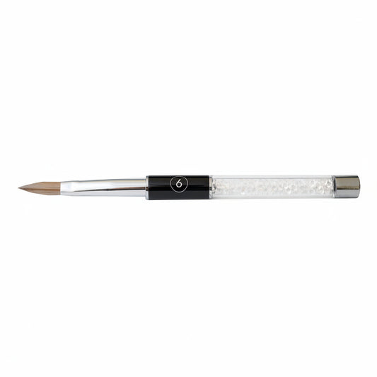 Acrylic nail brush with a black handle and silver ferrule on a white background