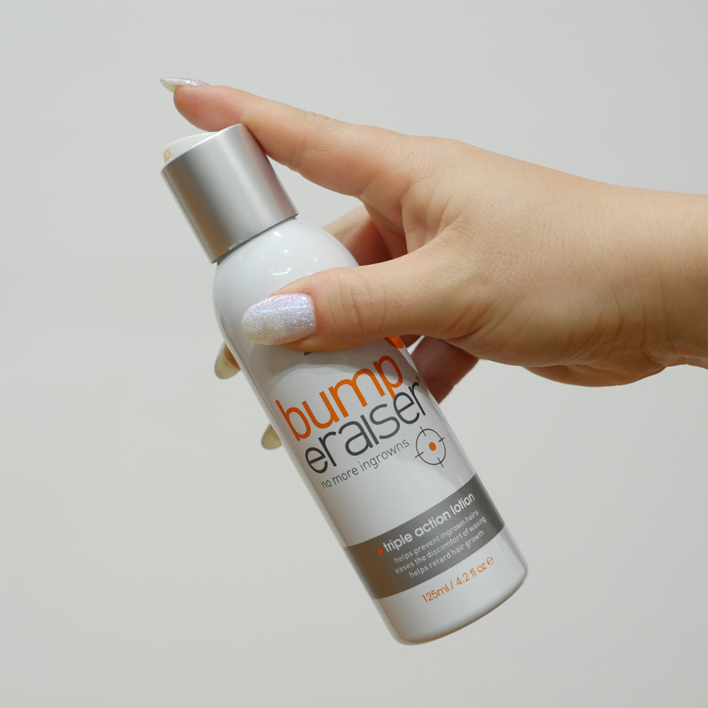 Bump eRaiser Triple Action Lotion 125ml for ingrown hair prevention held in hand