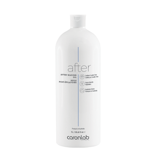 White bottle labeled 'after' waxing oil by caronlab on a white background