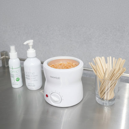 Caronlab Professional Mini Wax Heater warming professional wax in a salon treatment room ready for waxing services.