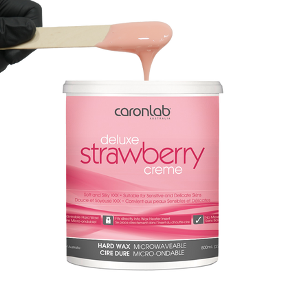 Caronlab strawberry creme hard wax with a spatula on a white background