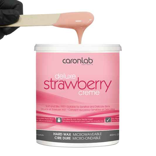 Caronlab strawberry creme hard wax with a spatula on a white background
