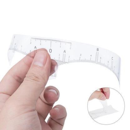 Close up of eyebrow mapping ruler applied for accurate brow measurement and symmetry