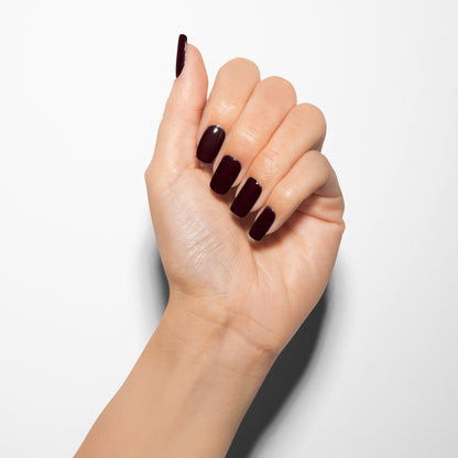 hand with Gelish Bella's Vampire on the nails