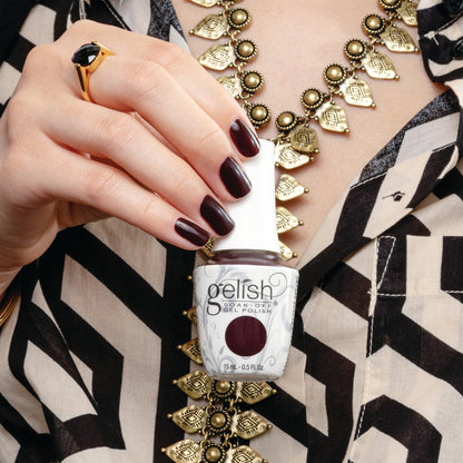 hand with Gelish Black Cherry Berry on the nails