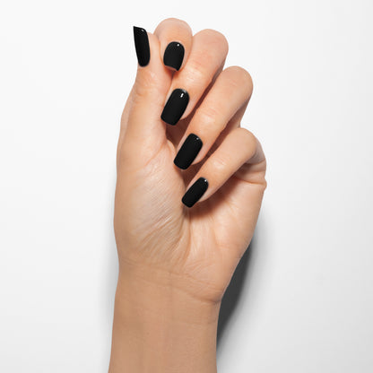 hand with Gelish Black Shadow on the nails