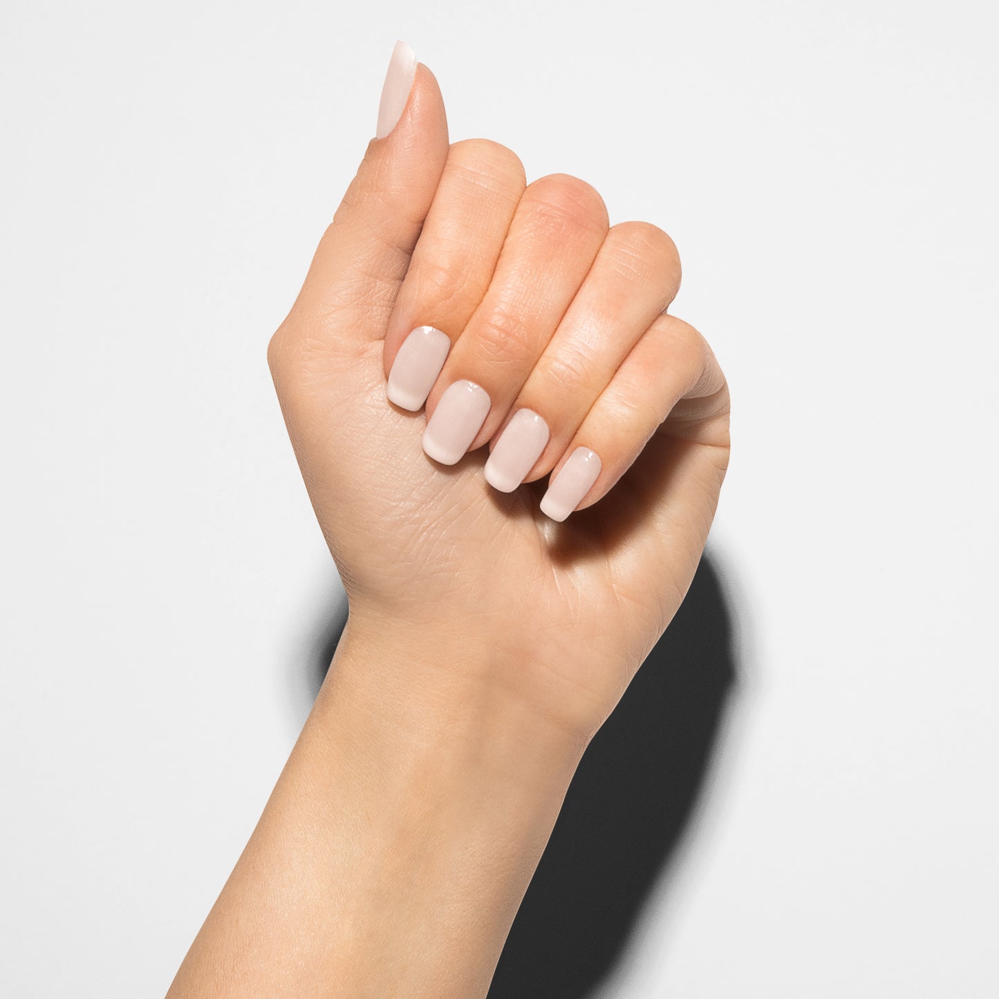 hand with Gelish Heaven Sent on the nails