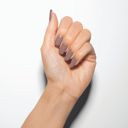 hand with Gelish I-Orchid You Not on the nails