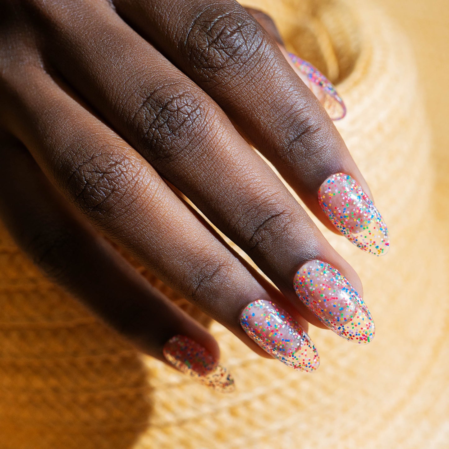 hand with Gelish Lots Of Dots on the nails