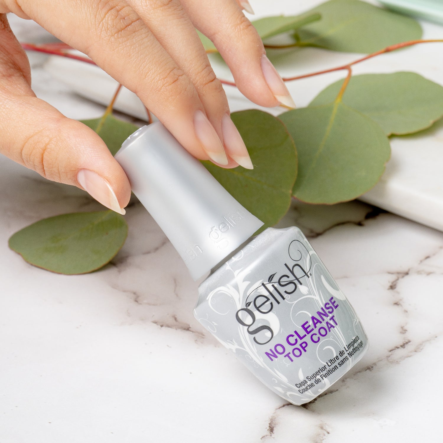 A bottle of gelish no cleanse top coat lifestyle image