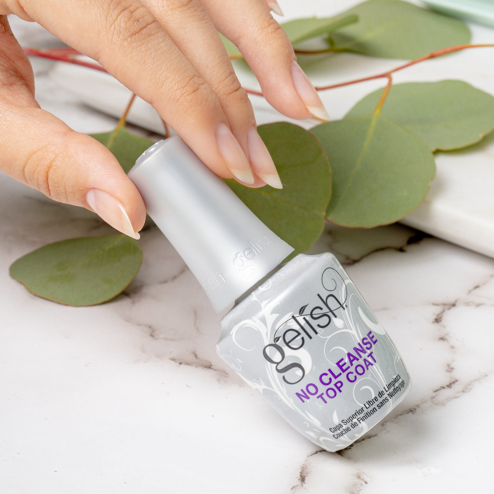 A bottle of gelish no cleanse top coat lifestyle image
