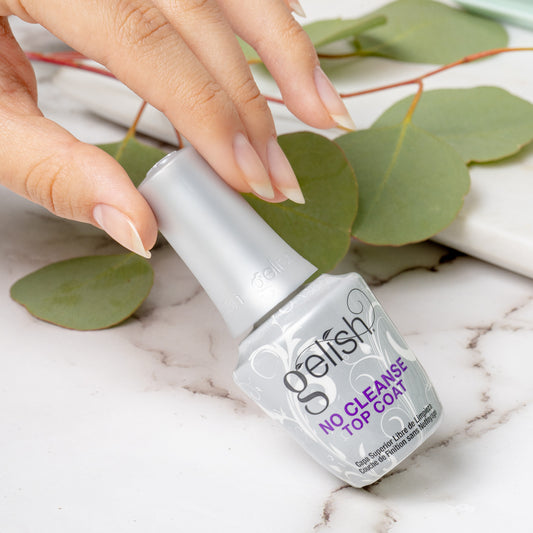 A bottle of gelish no cleanse top coat lifestyle image