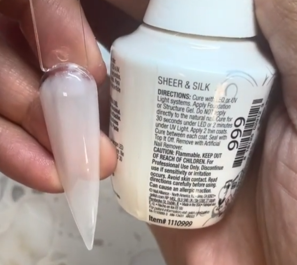hand with Gelish Sheer & Silk on the nails