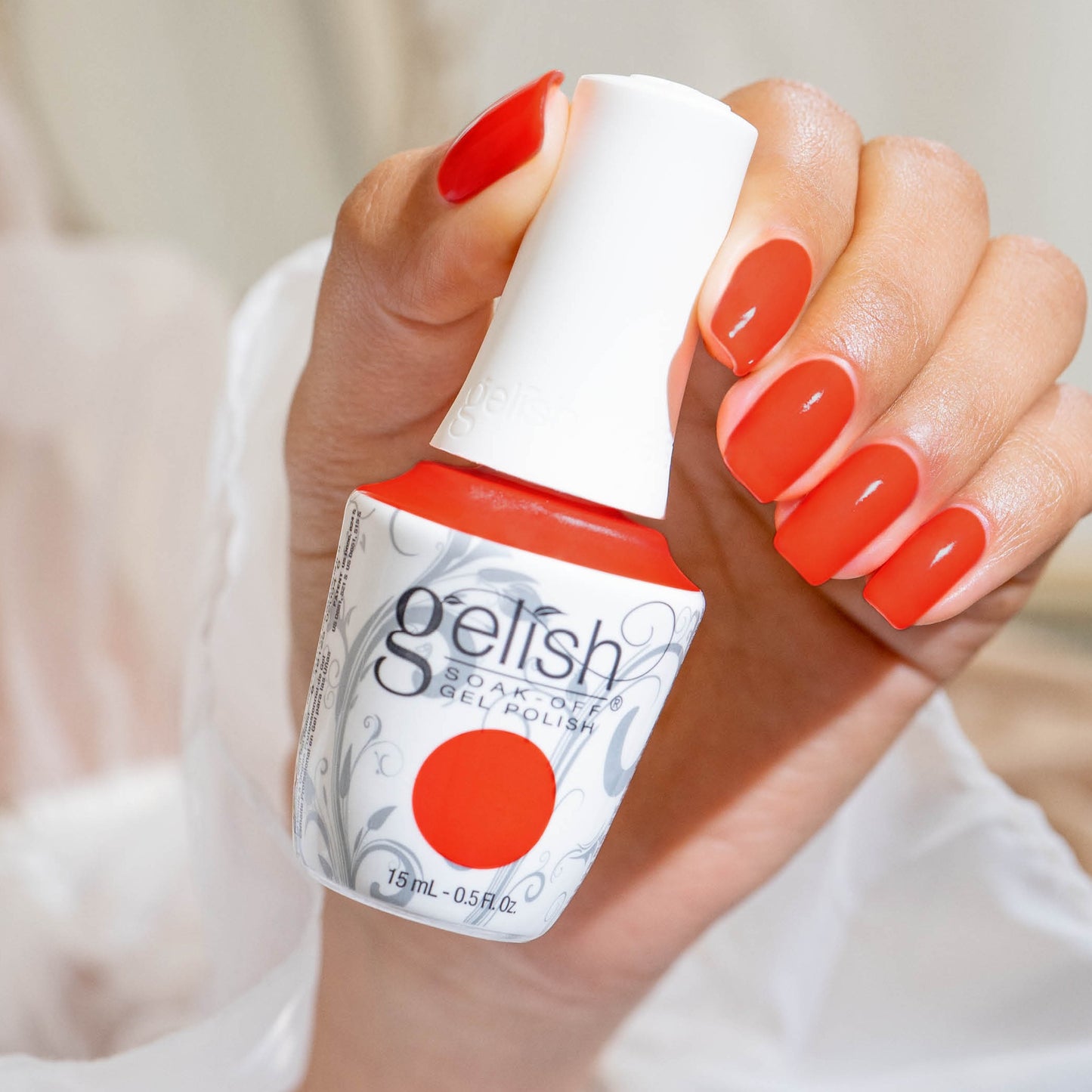 hand with Gelish Tiki Tiki Laranga on the nails
