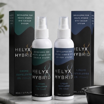Helyx Hybrid Creme Developer and Liquid Developer lifestyle image with professional lash and brow tinting accessories in a modern salon setting
