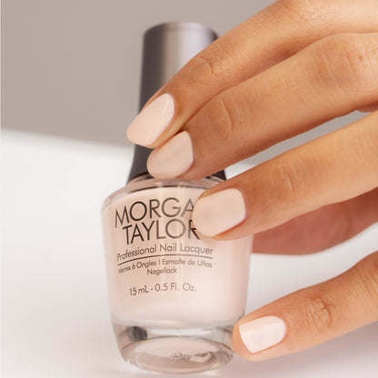 hand with Morgan Taylor Curls & Pearls on the nails