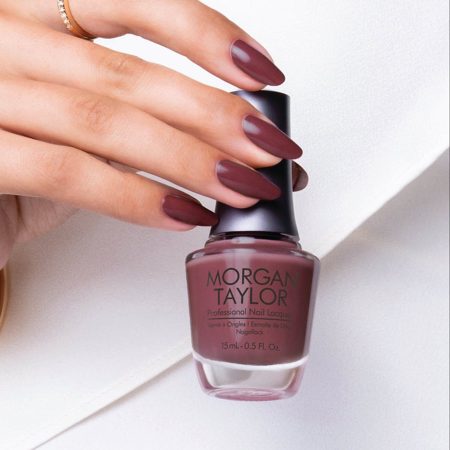 hand with Morgan Taylor Exhale on the nails