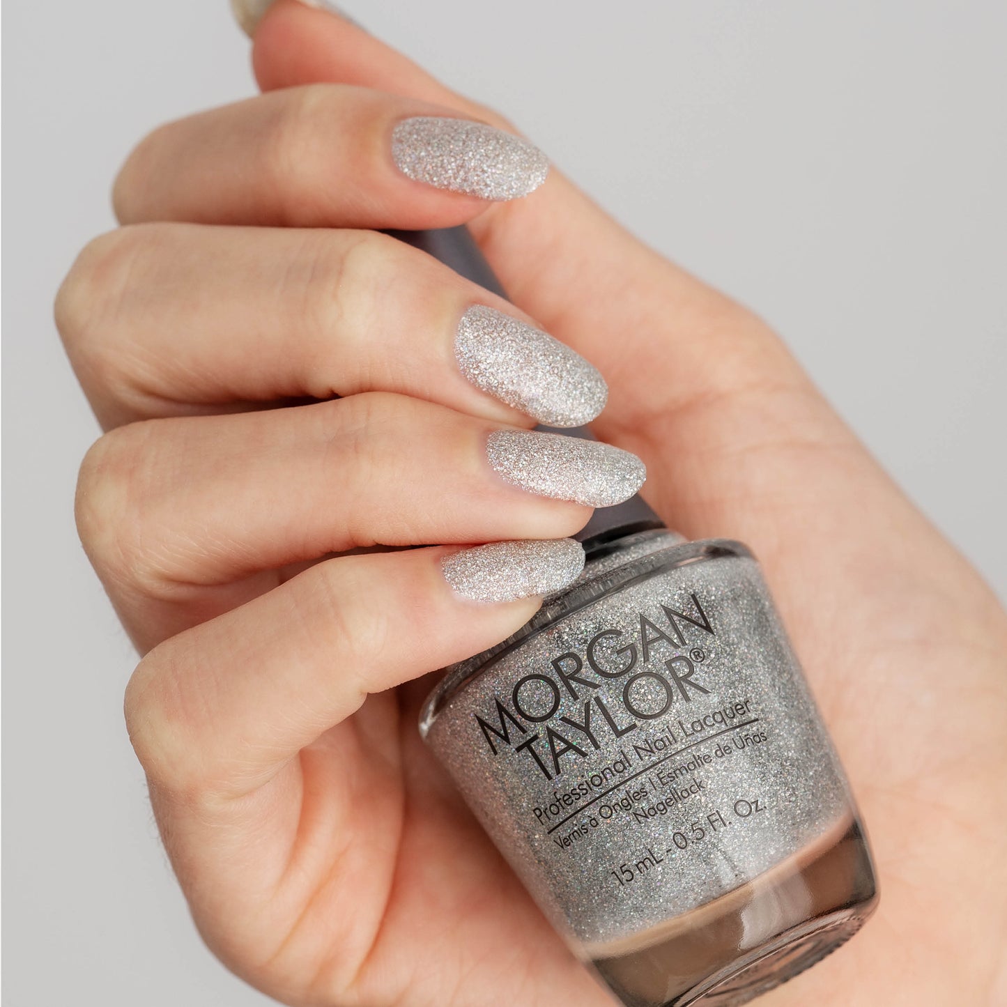 hand with Morgan Taylor Fame Game on the nails