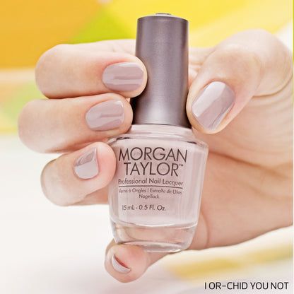 hand with Morgan Taylor I Or-Chid You Not on the nails