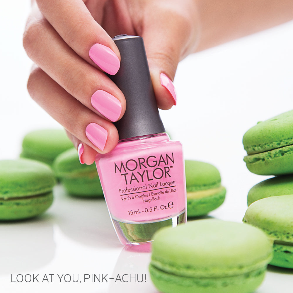 hand with Morgan Taylor Look At You Pink-Achu on the nails