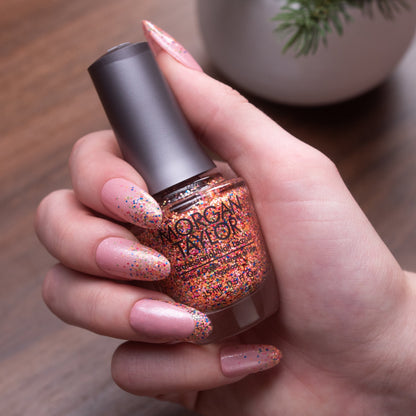 hand with Morgan Taylor Lots Of Dots on the nails