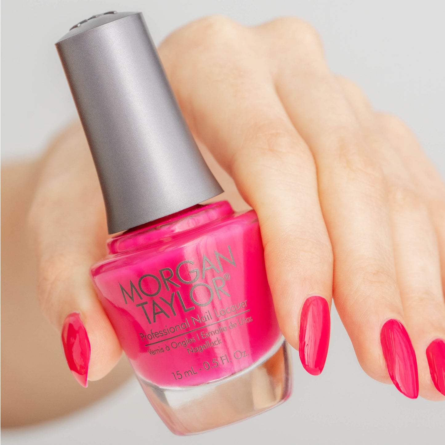 hand with Morgan Taylor Prettier in Pink on the nails