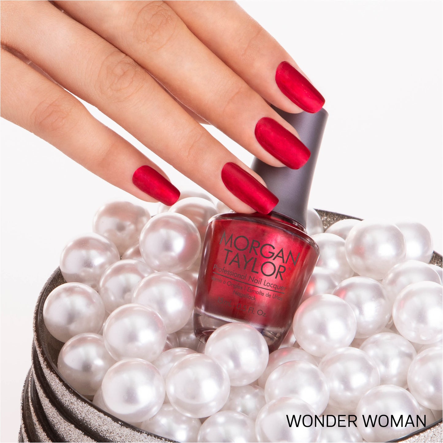 hand with Morgan Taylor Winder Woman on the nails