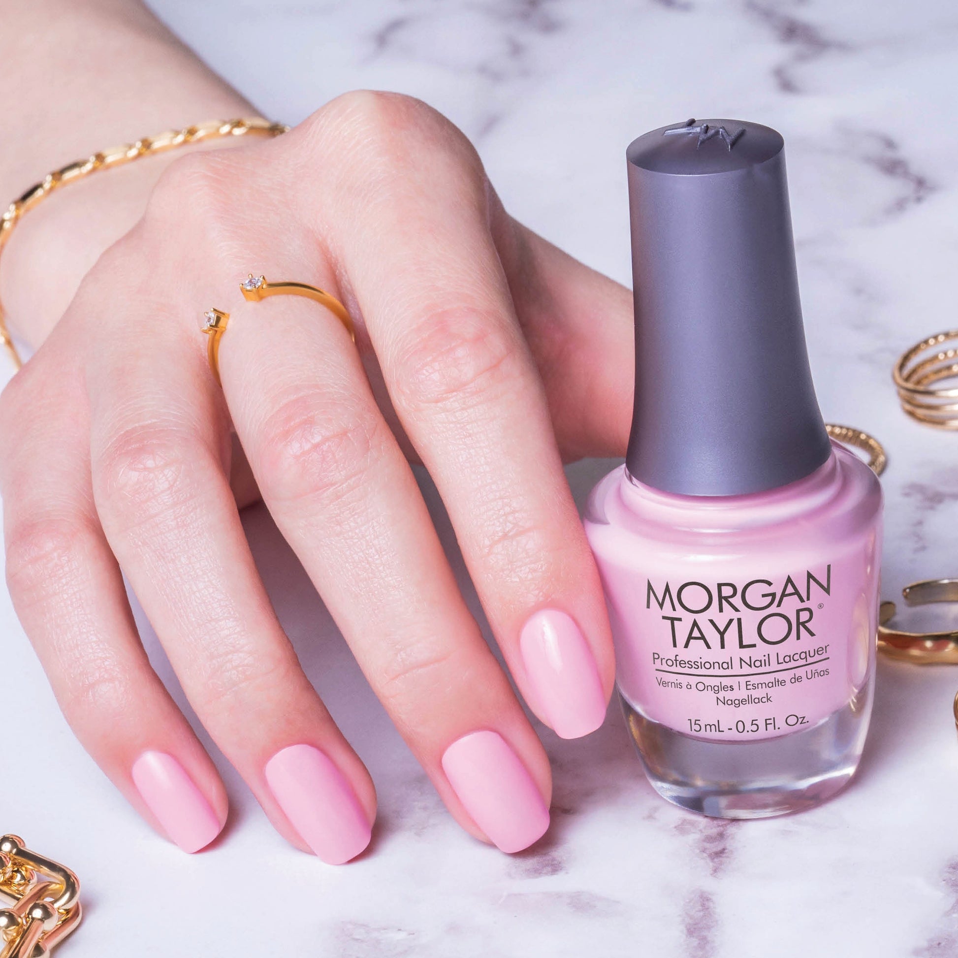 hand with Morgan Taylor You're So Sweet Your Giving Me Toothache on the nails