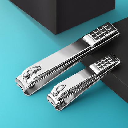 Two silver nail clippers large and small on a teal and black background