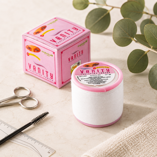 Professional 100% cotton eyebrow threading thread displayed in a clean salon-inspired setting for precise brow shaping and facial hair removal.