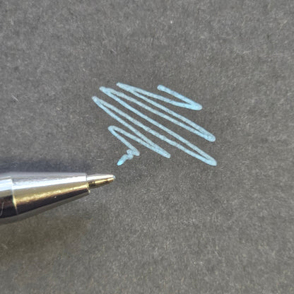 Blue professional skin mapping pen with fine precision tip and smooth pigment application on black background