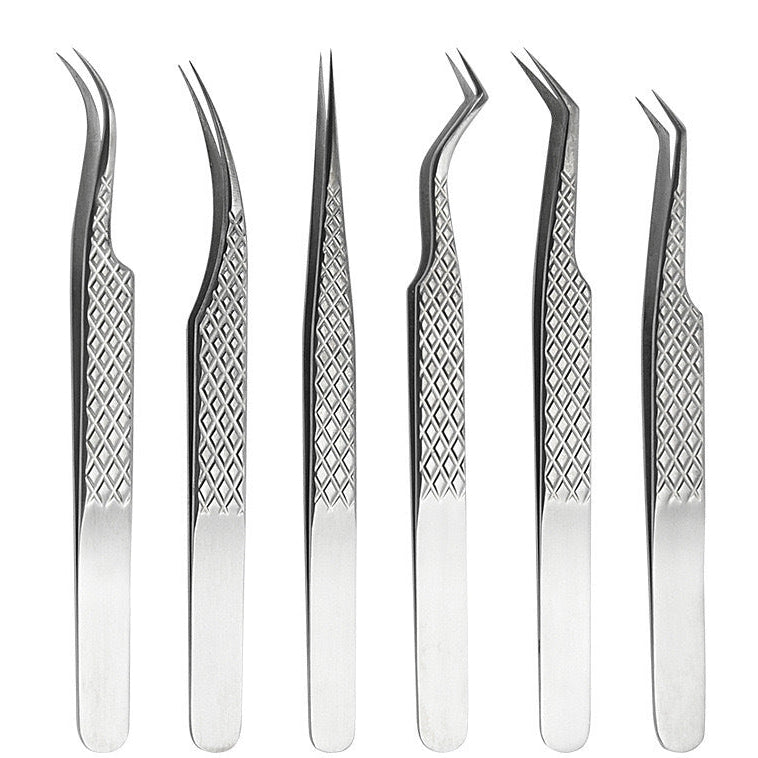 Set of six pairs of stainless steel eyelash extension tweezers on a white background
